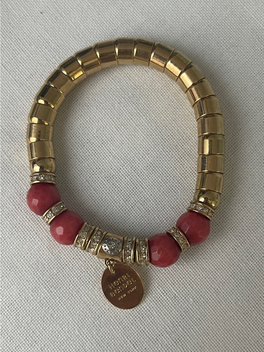 henri bendel Gold and Pink Faceted Bead Stretch Bracelet with Logo Charm